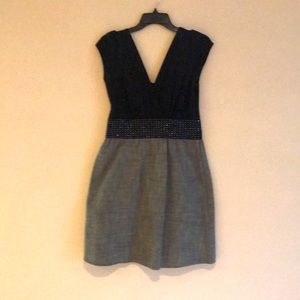 This adorable dress can be worn worn for work or play black top and gray skirt